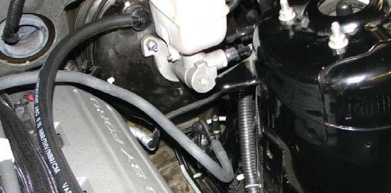 harness connector to the EVAP solenoid. 91. Remove the two inboard strut tower nuts from the passenger side strut tower. 87.