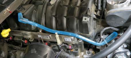 22. Remove the passenger side PCV hose from the