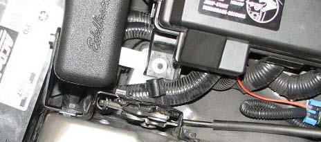 143. Use a 10mm socket to loosen rear hood hold down latch bolt on passenger side fender. 149.