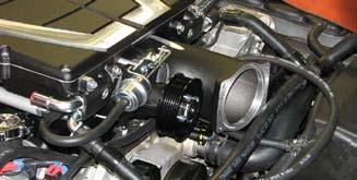 Clip the heat exchanger hose assembly to both lower fittings at the front of the supercharger manifold. 169.