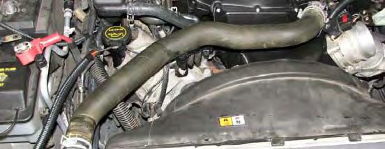 131. Reinstall the stock upper radiator hose between the thermostat housing and radiator and secure it with the stock hose clamps. 135.