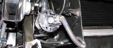 145. Route the intercooler water pump wire harness extending from the relay down to the intercooler water pump and