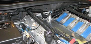 Since two of the stock manifold bolt hole provisions in the cylinder heads break into the crankcase and are not used with this supercharger, install the button head bolts supplied in Bag #3 in the
