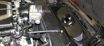 203. Connect the intercooler hose assembly to the two upper hose fittings at the