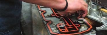 Trim the two (2) bosses projecting from the gasket to the base of their tapers to allow the valley tray