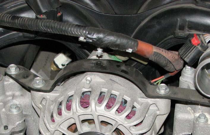 Insert a 1/2 drive breaker bar into the square hole of the belt tensioner.