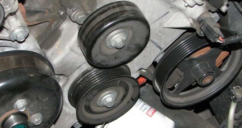 Use a pulley removal tool to remove the power steering pump pulley. 68.