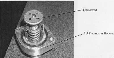 17) Replace the stock thermostat housing with the supplied housing making sure to install the thermostat in the correct position. 18) Secure new thermostat housing using the supplied 6mm x 1.