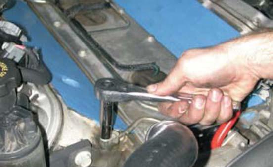 41. Using a 10mm socket wrench, remove the two or four coolant vent pipe