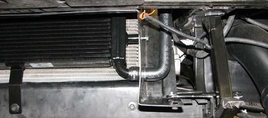 129. Use a 10mm socket and the four stock bolts to reinstall the upper radiator shroud