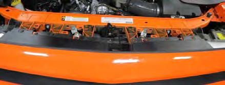 Using a panel puller, remove six (6) body pins from the front splash