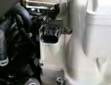 Using a 10mm socket, remove the bolt securing the stock airbox and