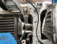 Remove the fan harness and clip from the radiator assembly.
