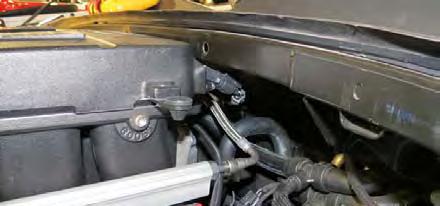 Install the driver side PCV hose onto the fitting next to the oil fill cap and then to the PCV