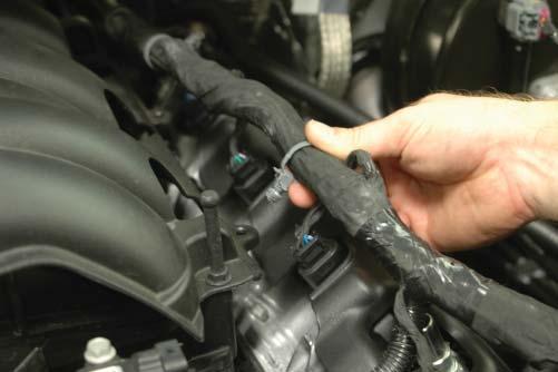 25. Remove the three harness tree clamps from the left side of the intake