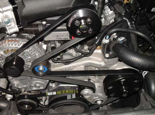Install the supplied idler standoff assembly with the supplied new bolt into the left alternator mount (shown with an arrow).