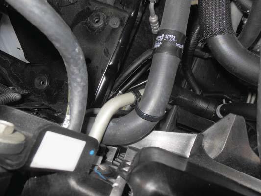 119. Install the plastic clamp from the last step around the oil
