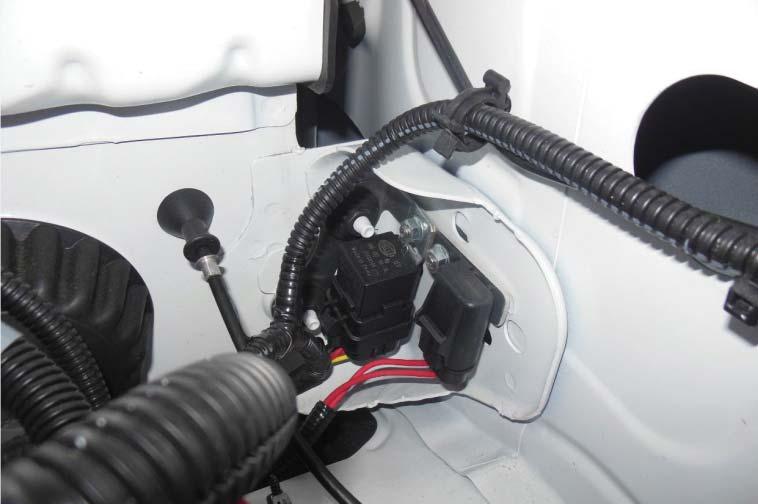 Place the supplied pump harness bracket onto the studs and use