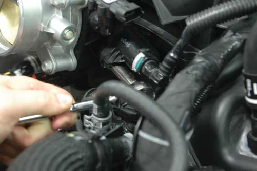 Use a 10mm wrench to remove the EVAP Solenoid from the intake manifold.