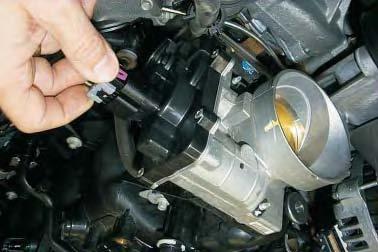 On late vehicles, disconnect the Electronic Throttle Control (ETC) connector from the throttle body by