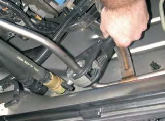 48. Using a tubing cutter, hack saw or cut off wheel, cut the air injection tube in