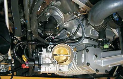 Route the tube under the supercharger nose and along the inside of the left fuel rail to the
