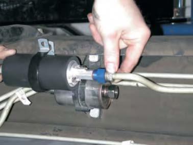Locate your vehicles fuel filter, usually located on the inside of the driver side frame rail.