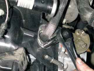 Using a 10mm socket wrench remove the 6mm bolt holding the (EGR)