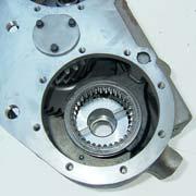 21. Remove the snap ring, thrust plate, and dowel pin from the original front output shaft. 22.