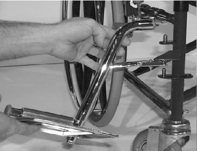FEATURES FOLDING AND UNFOLDING THE WHEELCHAIR Never let your fingers come between moving parts when you open or close this wheelchair. Doing so may cause a pinch or crush type injury.