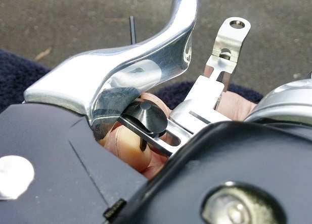 SECTION 3: CAM ADJUSTMENT AND FINAL ASSEMBLY 3.a Rotate the clamp until the cam support is positioned close to but not touching the bottom of the motorcycle brake lever.