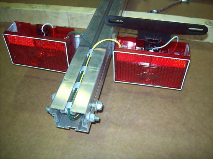 Install adhesive backed clamps in the locations shown and route