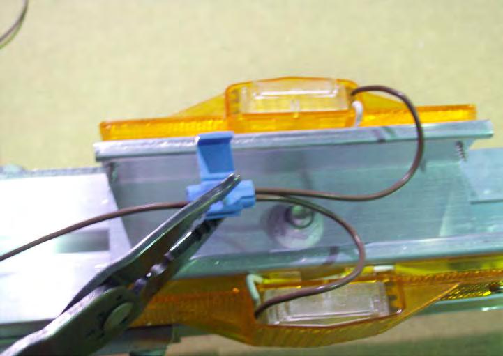 The wire should go in about ½. Pass the other wire through the remaining open slot in the connector at a point close to the running lights.