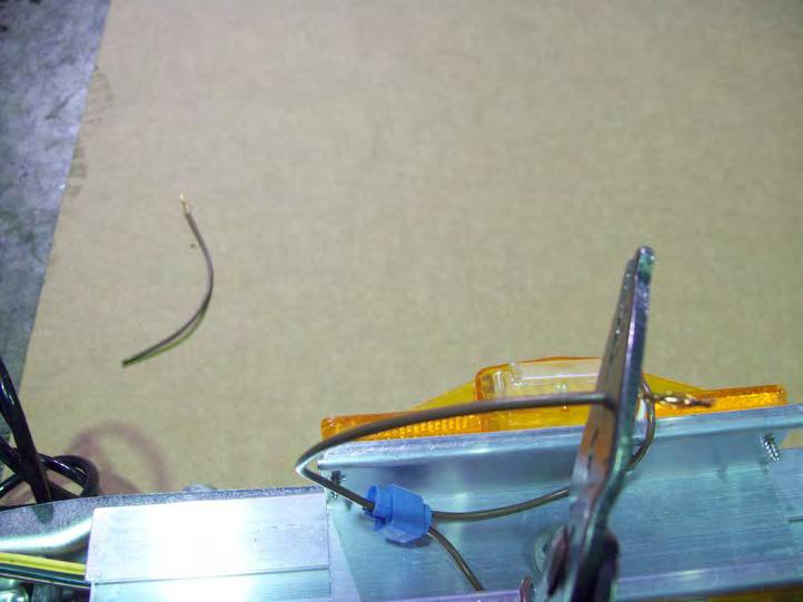 Cut the exposed strands of wire off of the end of the brown wire on the