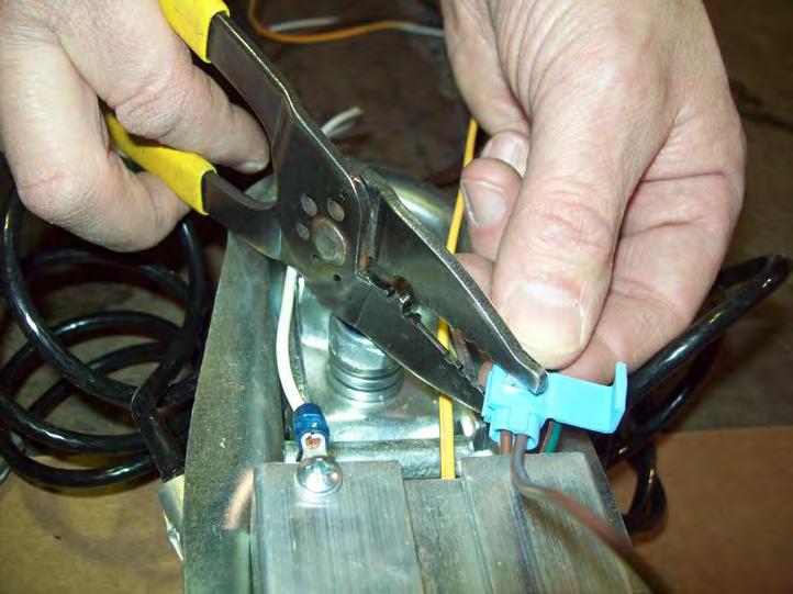 Insert the brown wire from the running lights into the closed side of the connector and