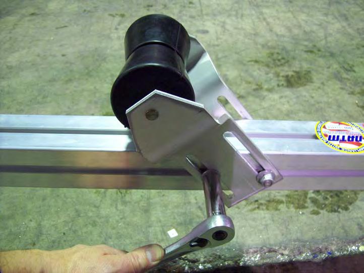 Align the roller bracket with the two rear T-bolts on the front tongue