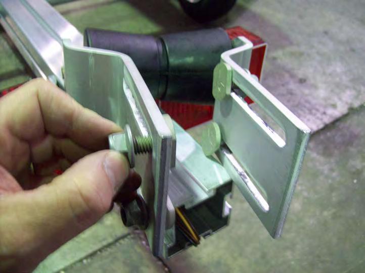 With the roller bracket tilted, gradually pull it over to the other side
