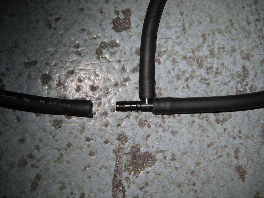 hose. Unclip the washer hose where it passes along the length of the bumper and