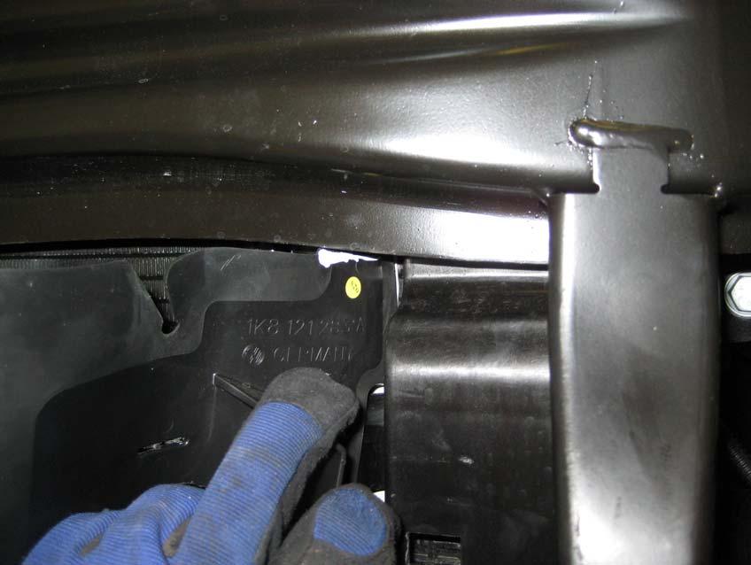 11. Working at the front of the car, cut the plastic air guides on both sides at the point marked below.