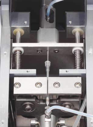 Efficient LC-MS/MS Workflow SCAP PLS system robotic gripper tool picks-up sample cartridge and places it into the SCAP PLS system clamp module where it is pierced at both ends and flushed into the