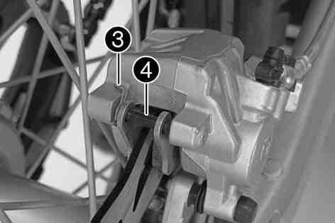 Press the brake caliper onto the brake disc by hand in order to push back the brake pistons. Make sure that no brake fluid escapes from the brake fluid reservoir. If it does, clean it up.