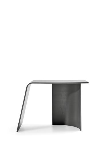 patricia urquiola small table created from the union of two curved elements.