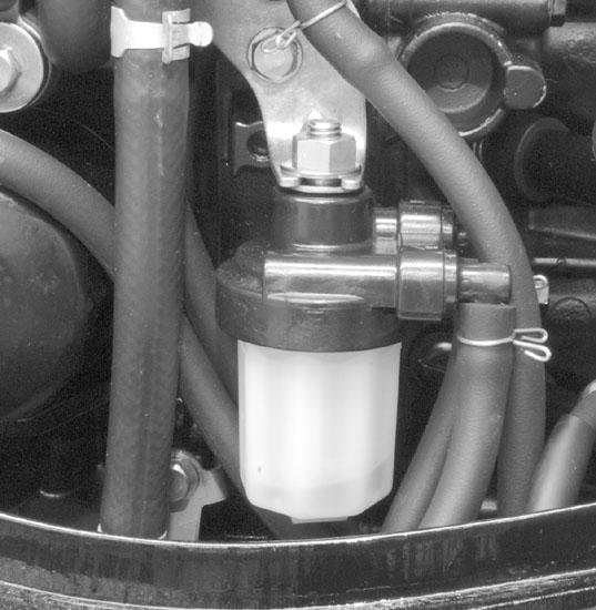 MAINTENANCE FUEL FILTER (LOW PRESSURE) Check the fuel filter for water accumulation or sediment. If water is in the fuel, remove the sight bowl and drain the water.
