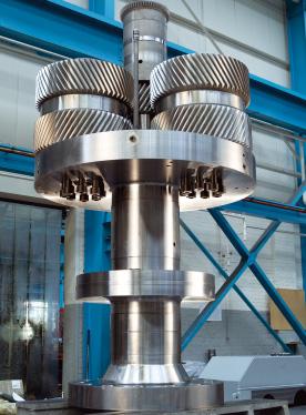 the bearing losses experienced when reacting the thrust loads generated by single helical gears are, therefore, eliminated.