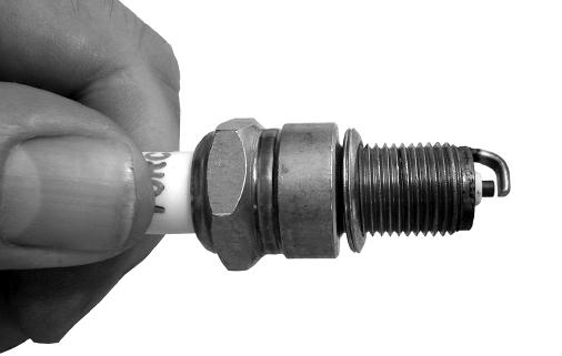 8mm) between the center electrode and side electrode (Fig. 20). 5. Refit the spark plug (18) and tighten with the spanner supplied. Fig.