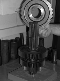 With clutching teeth down, position the 2nd gear on the mainshaft. 11. Position the washer against the gear.