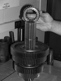 Transmission Overhaul Procedures-Bench Service 13. Position the washer against the gear. Rotate the washer until the washer splines and mainshaft splines align.