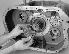 Transmission Overhaul Procedures-Bench Service 6. Install the tanged washer into the reverse gear. 7. Install the snap ring into the reverse gear. 8.