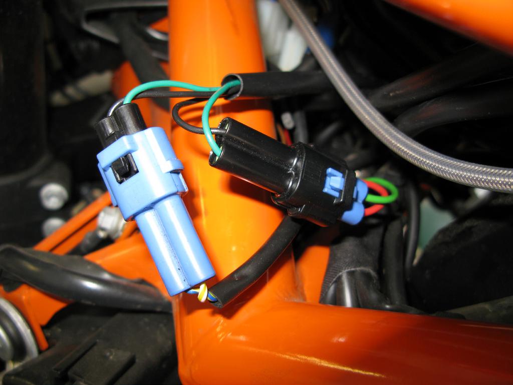 Take the portion of Bazzaz harness containing the crank position, speed, neutral sensor s and route it through the frame in front of the air box to the left side