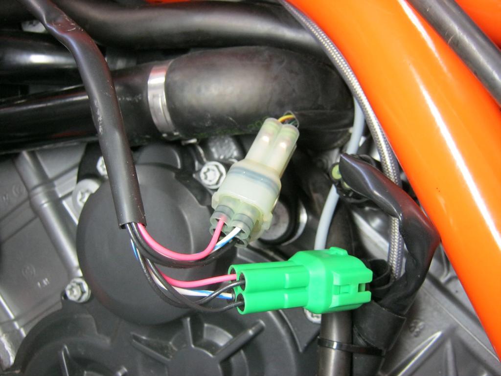 Locate the crank position sensor s on the factory harness, which are blue in color and can be found near the left air inlet opening of the air box (photo 1).